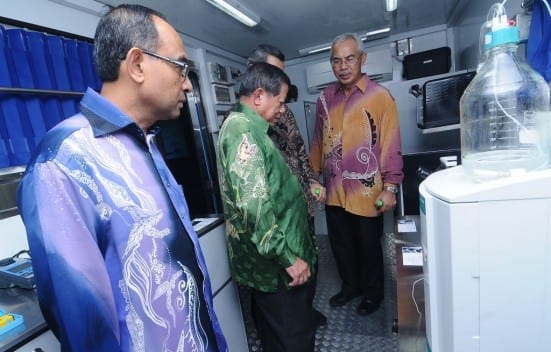 Dr. Salleh Mohd. Nor (second left) with Prof. Wahid (most left) and Prof. Azraai (most right) visiting UTM Water Quality Analysis Mobile Laboratory after the launching ceremony