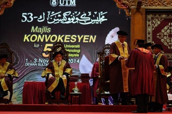Graduates receiving scroll at UTM 53rd Convocation ceremony held at Dewan Sultan Iskandar, Johor Bahru campus