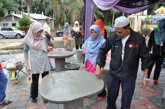 UTM Faculty of Civil Engineering staff showing the table made from Ferro Cement