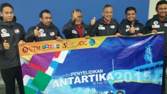Prof Mazlan (third left) and other researchers holding a banner about the UTM Antarctica Research Expedition 2015