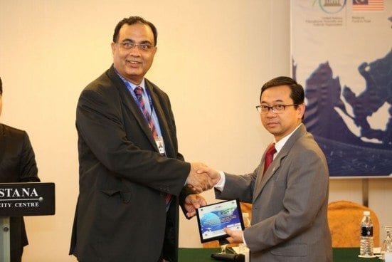 Prof. Dr. Shahbaz  Kahn, Officer in Charge UNESCO Office Jakarta receiving a token of appreciation by Prof. Dr. Ahmad Fauzi Ismail