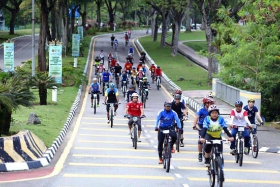 The UTM Ecotourism Fun Ride 2015 participants cycling at the university main gate