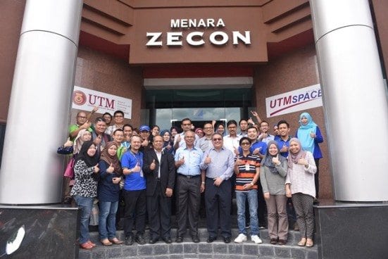 Prof Mohd Azraai and Hj. Zainurin infront of Menara Zecon.