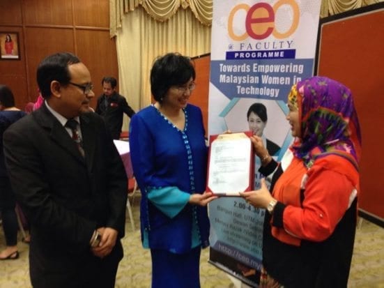 Dato’ Yasmin receiving a letter of appointment from Prof. Dr Rose Alinda and witnessing by Dean of Faculty of Computing Professor Dr Abdul Samad Ismail.