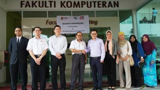 VTC Chief Executive Officer, Chan Wai Hoong (five left) shaking hands with Dean Faculty of Computing, Prof. Dr. Abd. Samad Ismail (fourth left). Joining the photograph session was Salina Muhammad Zain, Senior Vice President of Client Support of i2M Ventures Sdn. Bhd (fourth right).