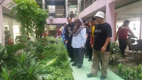 YB Normala (second right) accompanied by Deputy Vice Chancellor (Development) Prof. Azlan Abdul Rahman (black batik) at the site of The Residential Transformation Project at Flat Taman Plentong Utama.