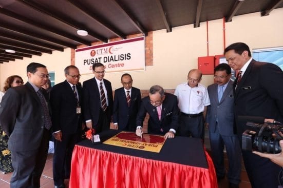 Mohamad Zabidi (fourth right) signing a plaque as a symbol of launching of UTM Dialysis Centre at Johor Bahru campus.