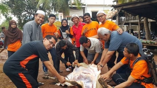 Conducting a sacrificial activity during the holy Eid al-Adha celebration.