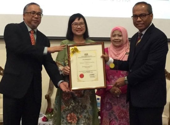 UTM Registrar, Wan Zawawi Wan Abdul Rahman (most right) receiving the award from National Archives of Malaysia, Azemi Abdul Aziz while been witness by Deputy Secretary General (Management), Ministry of Tourism and Culture of Malaysia, Dr Junaida Lee Abdullah in the middle.