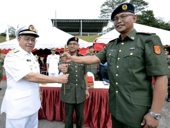 Prof. Alias (left) handing over the golden baton as symbol of authority as PALAPES Deputy Commander to Dr. Mohd Noor Ali Khan at handover ceremony held at PALAPES UTM 