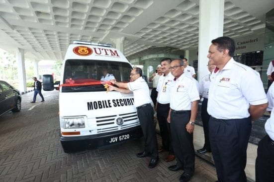Prof Wahid (most left) cutting ribbons as symbol of launching the new UTM Security Division Mobile Station vehicle