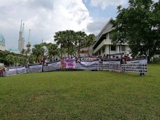 The Secreteriat of Corruption Prevention of UTM holding giant banner to support the Anti-Corruption campaign