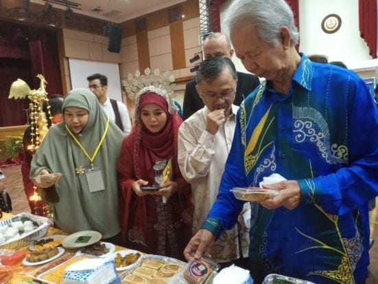 The distinguished guests sampling the traditional cuisines