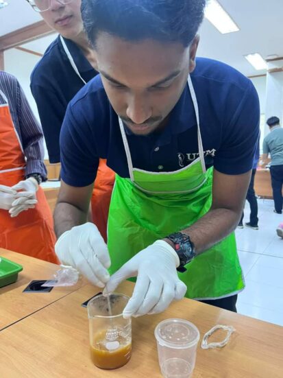 Picture of a student in the soap-making process