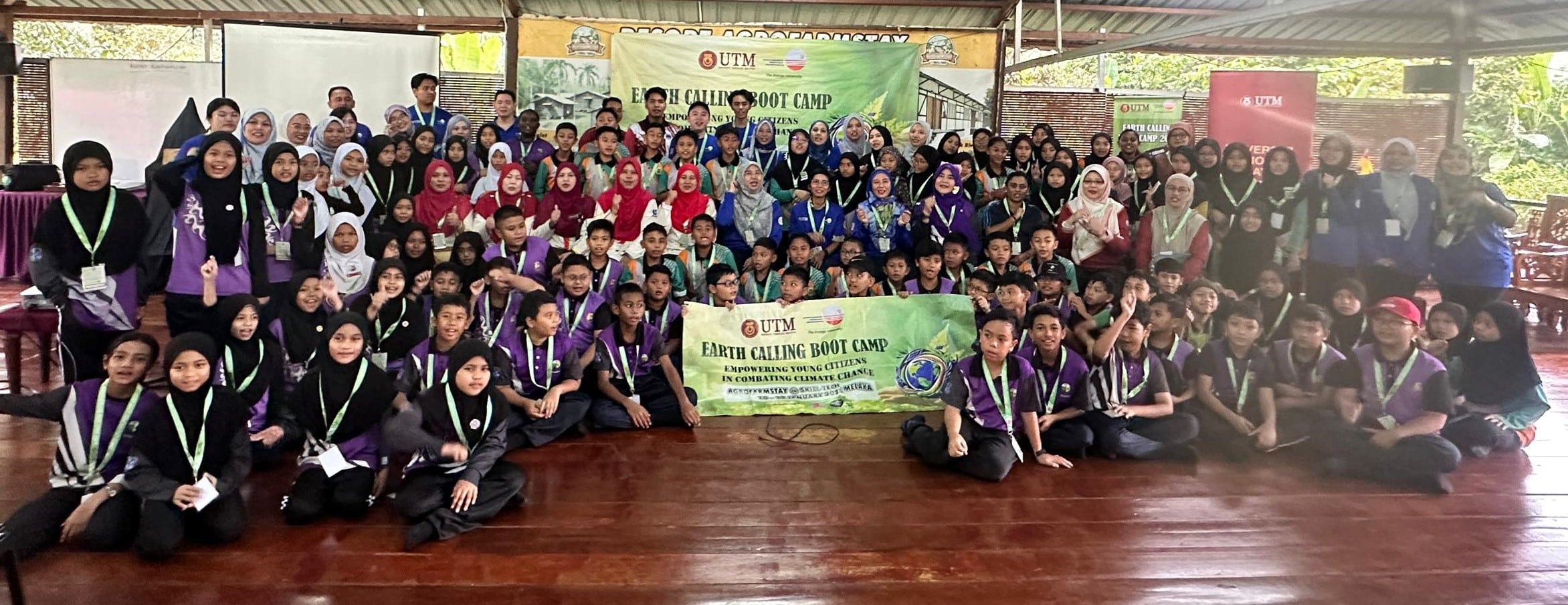 Participants of the Earth Calling Boot Camp 2025 pose with program organizers, facilitators, and the U.S. Embassy Kuala Lumpur representative, celebrating a collaborative effort to combat climate change