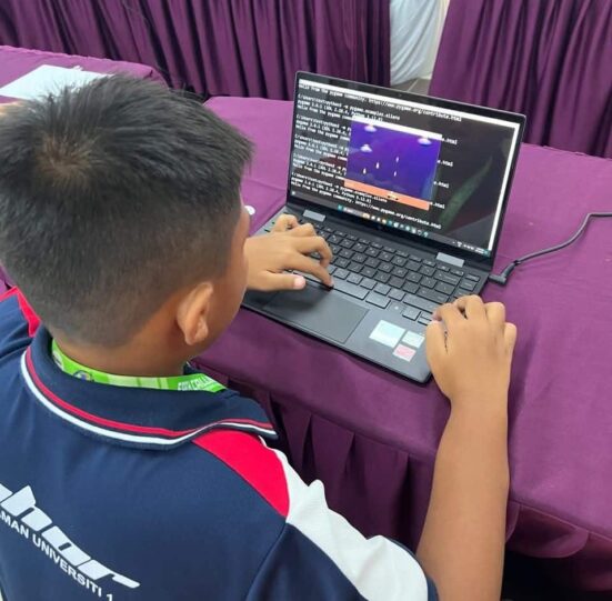 Learning Through Code: young participants are introduced to the world of programming in the 'Coding for a Greener Planet' activity, showing how technology can be harnessed to create solutions for climate change and empower future environmental heroes.