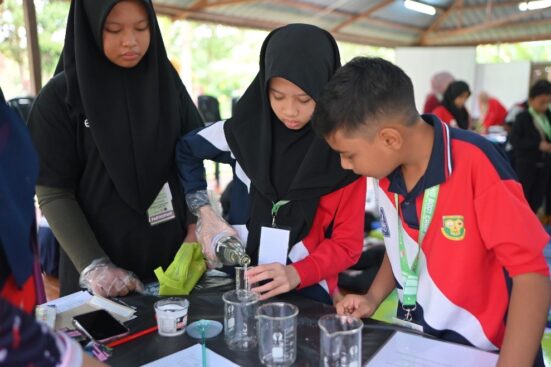 Exploring Climate Science: Students conduct experiments to understand the principles of greenhouse gases, gaining hands-on insights into their role in climate change and its impact on the environment.