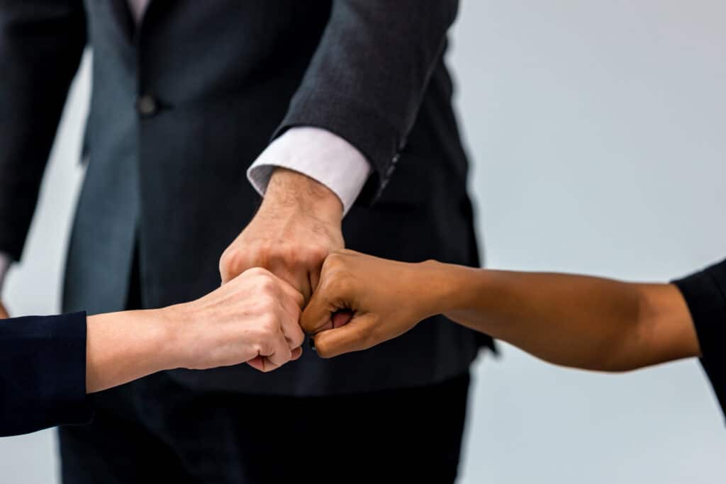 Diverse colleagues gather in brainstorm discuss statistics toget